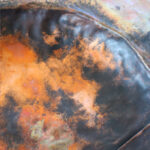 Large folded copper bowl
