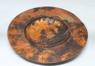 Large folded copper bowl