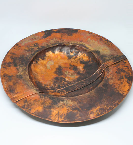 Large folded copper bowl